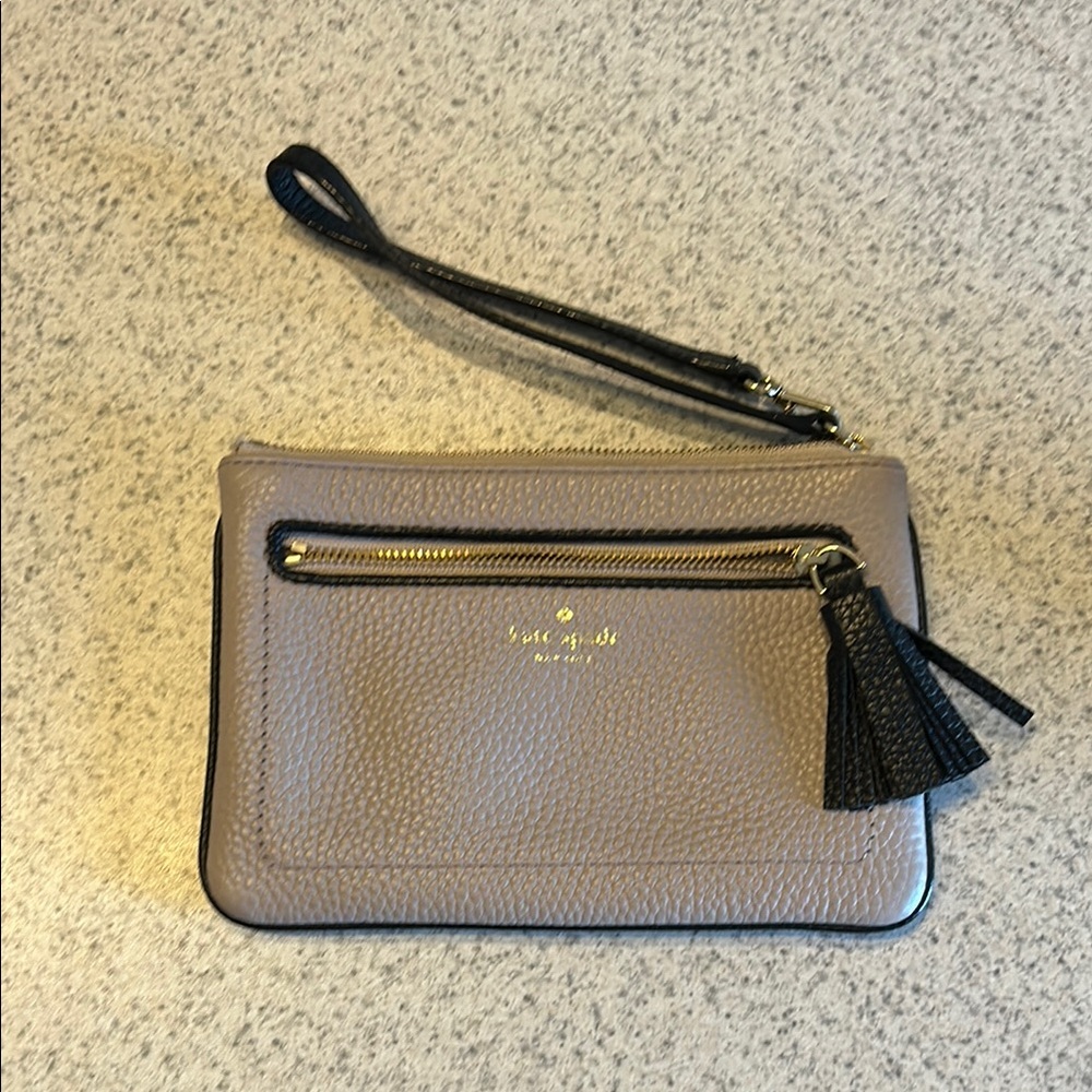 Kate Spade Beige Wristlet with Black Tassel